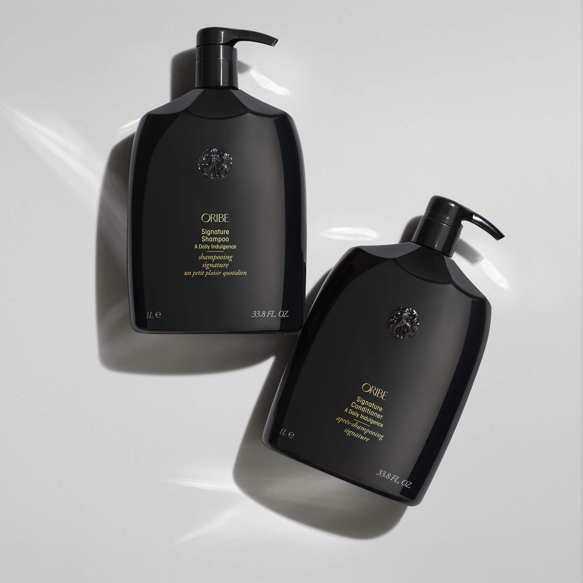 Light Gray Oribe Signature Shampoo & Conditioner Set - Hydrates Hair & Adds Shine