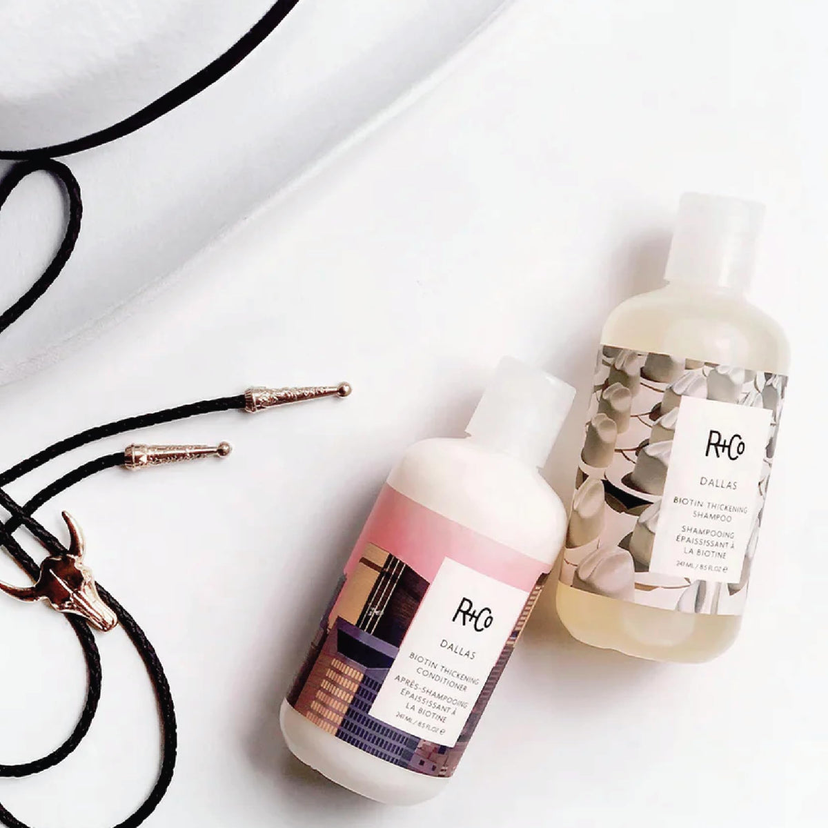 White Smoke R+Co Travel Size Shampoo and Conditioner