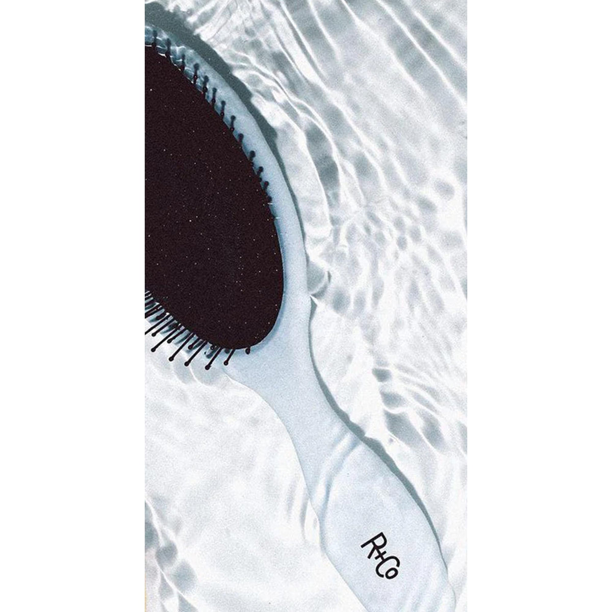 Lavender R+Co Detangling Brush