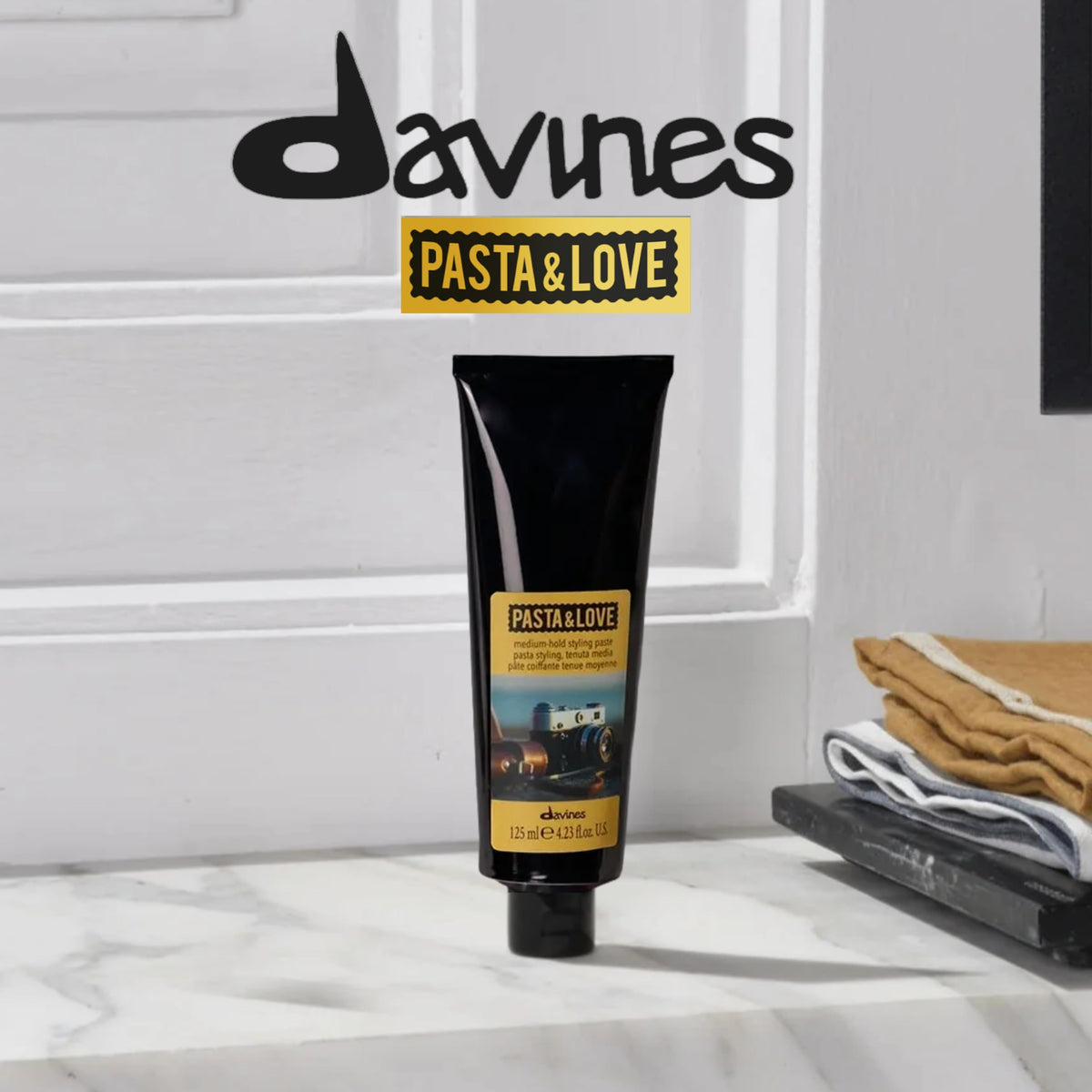 Gray Davines Pasta & Love Medium hold workable styling paste, natural finish
