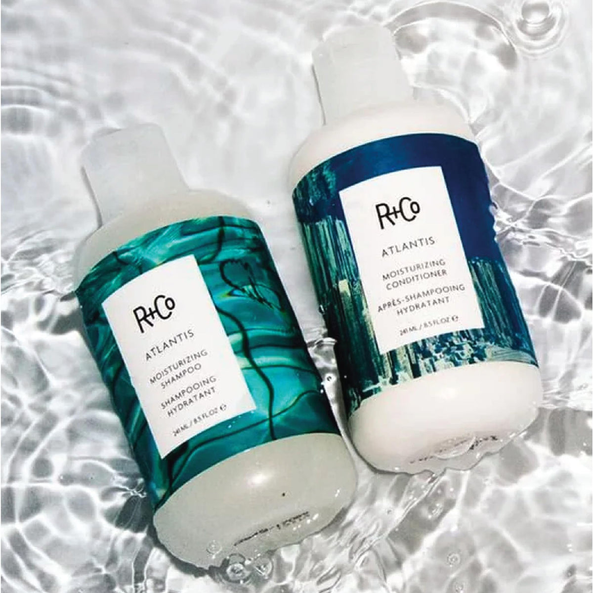 Light Gray R+Co Travel Size Shampoo and Conditioner